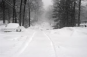 Car stuck in snow storm tips